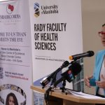 Dr. Sarah-Jane Sass, the first sleep medicine fellow at UM, waits to speak as Dr. Nancy Porhownik, sleep specialist and UM faculty member, announces the fellowship.