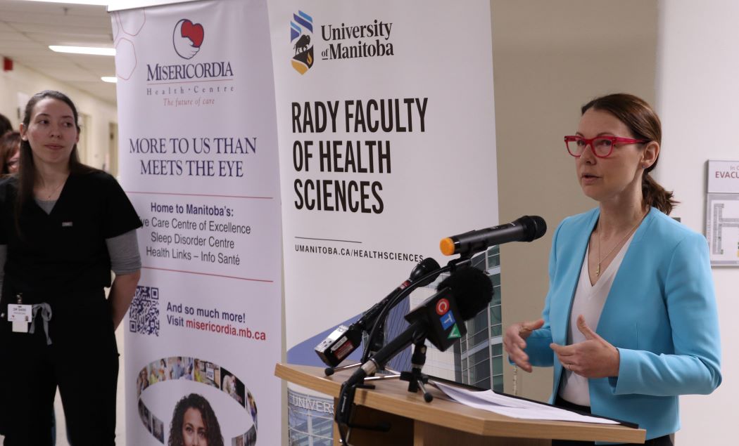 Dr. Sarah-Jane Sass, the first sleep medicine fellow at UM, waits to speak as Dr. Nancy Porhownik, sleep specialist and UM faculty member, announces the fellowship.