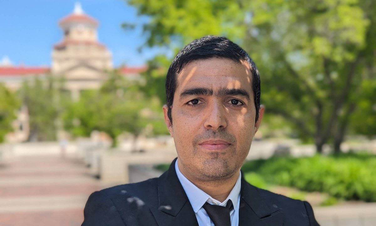 Faouzi Bellili poses with the UM Administration building in the background.