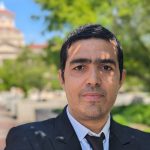 Faouzi Bellili poses with the UM Administration building in the background.