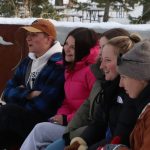 A group of students laughing during an outdoor lesson