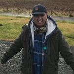 Men with a hat and green jacket