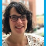 Dr. Orly Linovski smiles outdoors.