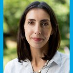 Dr. Leslie E. Roos headshot, taken outside in afternoon light.