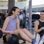 Three women in a gym.