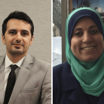 man with grey jacket and black tie; woman with green hijab both smiling