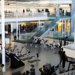 View of Active Living Centre fitness floor and climbing wall from the upper level track.