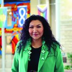 Margaret Hart stands in the Brodie atrium at Bannatyne campus.
