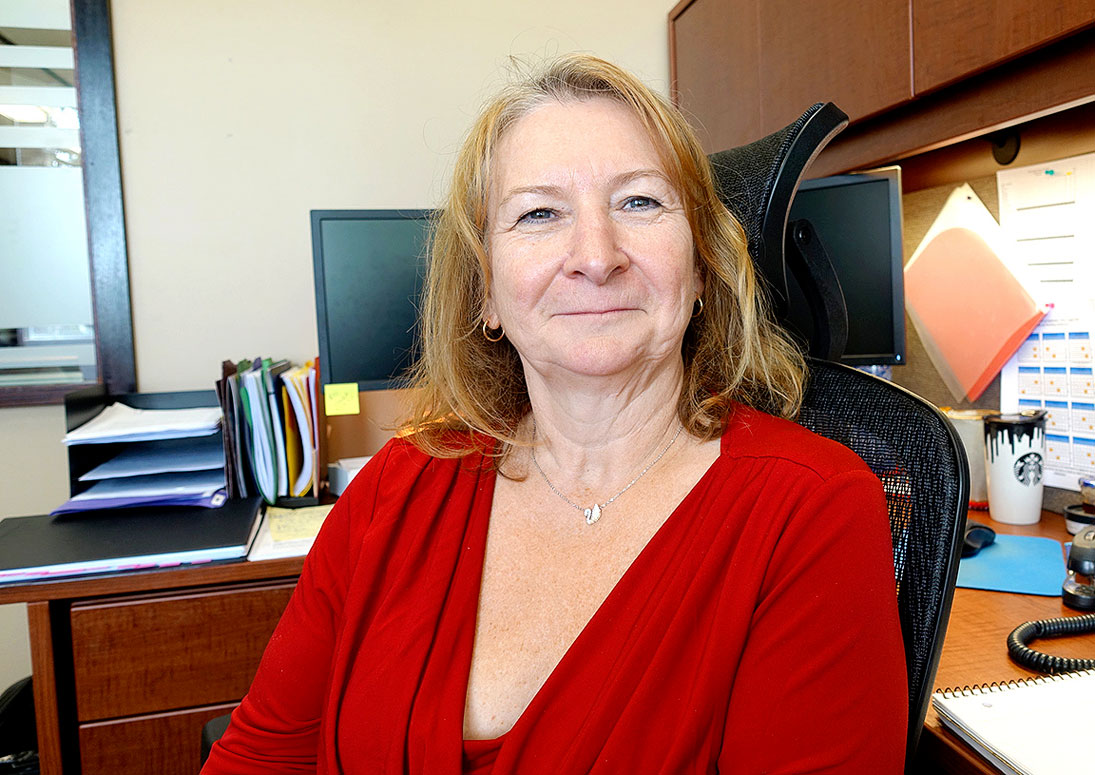 woman with red sweater and smiling