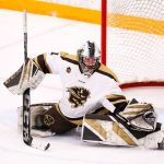 A Bisons hockey goalie makes a save