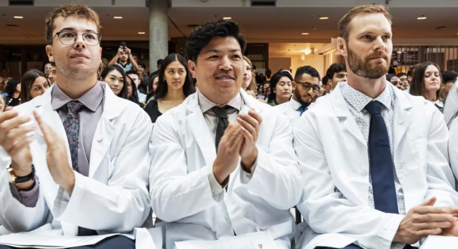 Kodley Bouachanthala, centre, is one of the 140 students in the University of Manitoba college of medicine's class of 2028. He says he can see himself one day retuning to Morden, Man., his home community. (Prabhjot Singh Lotey/CBC)
