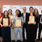 Winners and judges pose together with the Falling Walls Manitoba trophies.