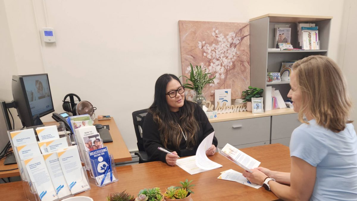 Family Resource Coordinator speaking with a client in her office