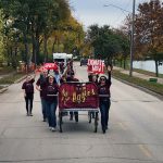 Aggie students push a bed for the 2024 campaign