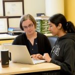 Dr. Sabine Kuss and Shubhneet Thind, student in science talking.