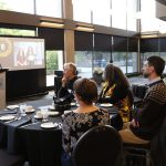 Presenter addresses attendees of the 2024 TLC graduation