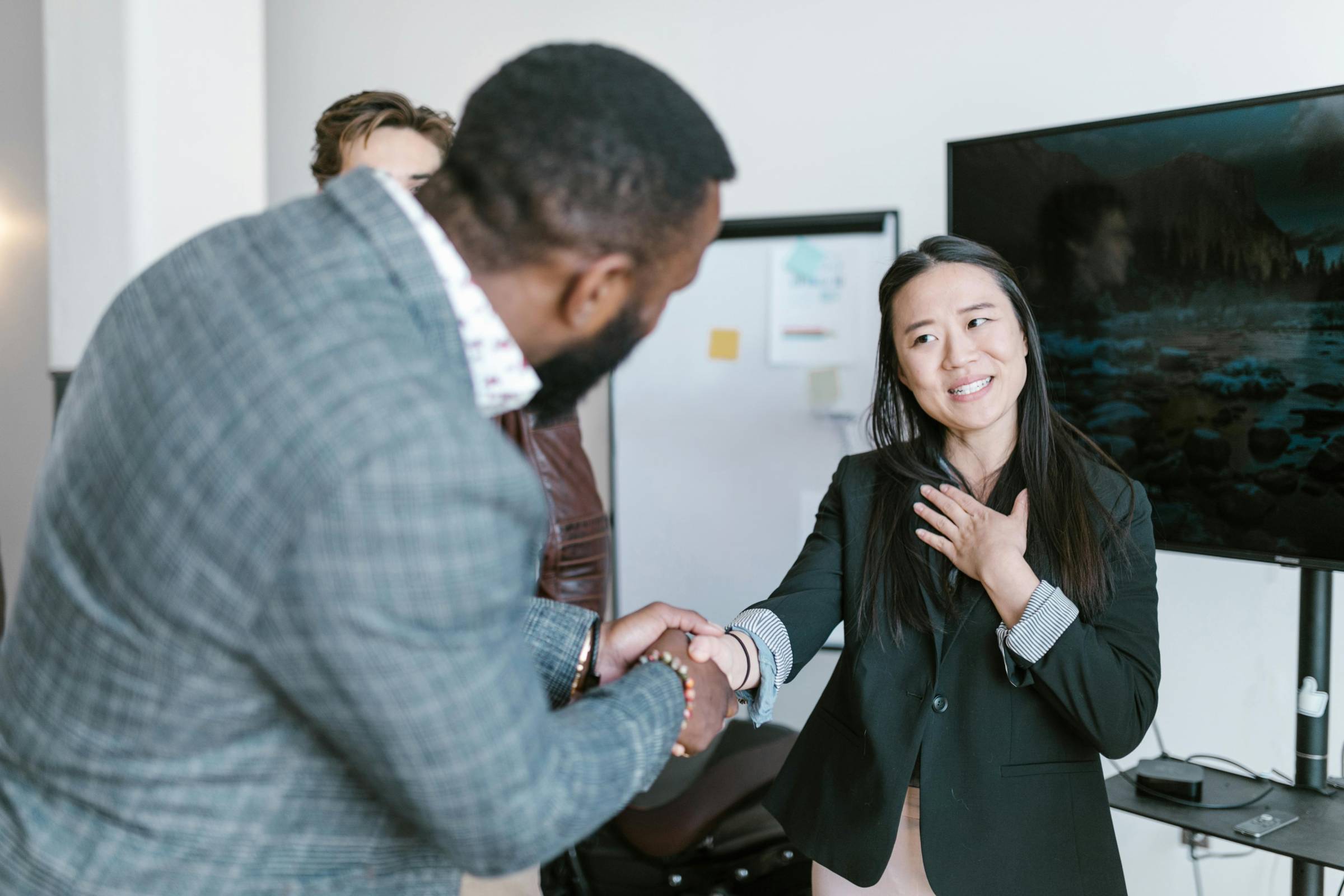 a lady and man shaking hands