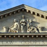 Winnipeg, Manitoba, Canada: historic Provincial Law Courts - pediment : blind justice and cornucopias in the tympanum - photo by M.Torres