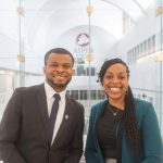 Two Black students smiling, at the Asper School of Business