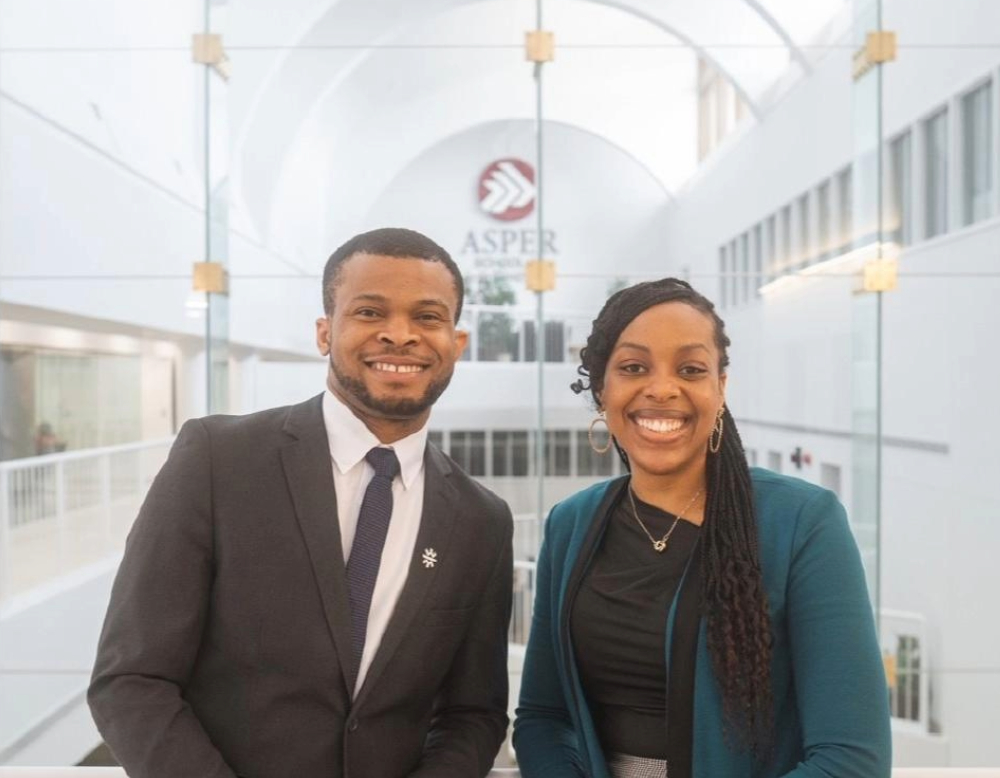 Two Black students smiling, at the Asper School of Business
