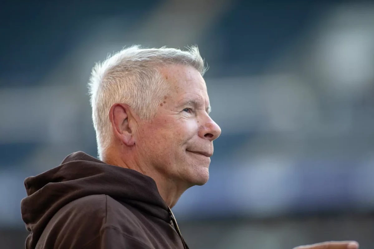 Brian Dobie smiling while looking in front of him