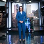 Amanda Lang standing in a broadcast studio
