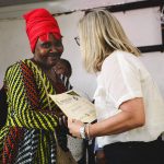 Chancellor Anne Mahon shakes Gladys' hand while giving her a certificate