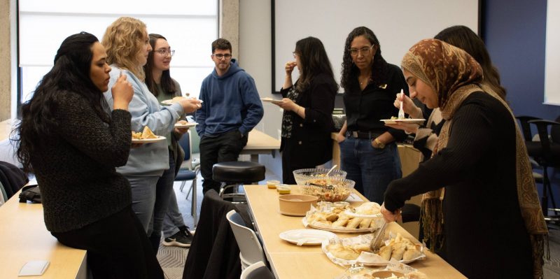 A multi-faith gathering of law students at Robson Hall, breaking bread together to foster community. Photo: Christine Mazur