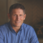 Photo of Steve Young NFL footballer, wearing a bright blue button down shirt