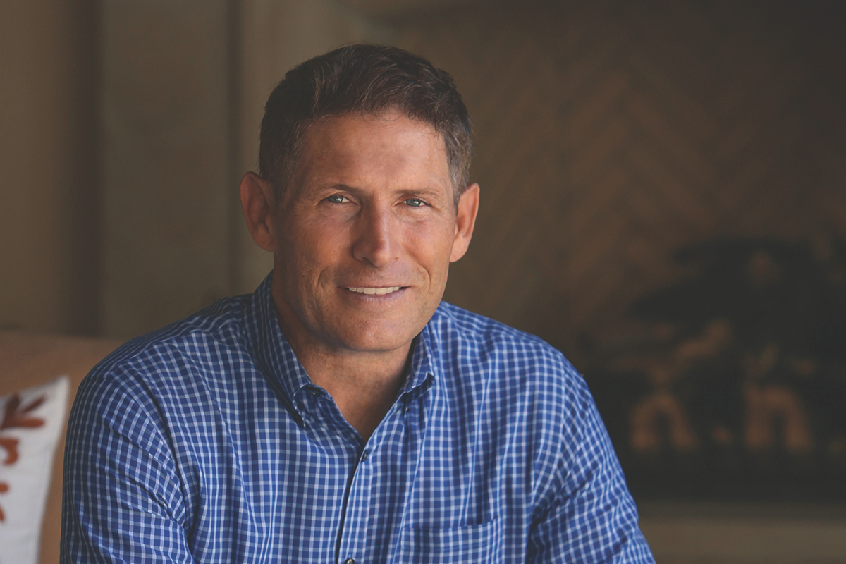 Photo of Steve Young NFL footballer, wearing a bright blue button down shirt