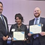 Three people smiling with two holding certificates indicating that they are finalists in the MacIntyre Moot Competition. Far left is Chief Judge of the Manitoba Provincial Court Ryan Rolston, then 3rd year law students Maria Garcia Manzano and Harlan Morris.
