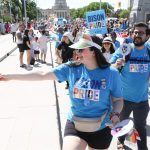 UM community members walk in the 2024 Pride Winnipeg Parade.