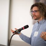 Man speaking at a podium at SoTL 2023