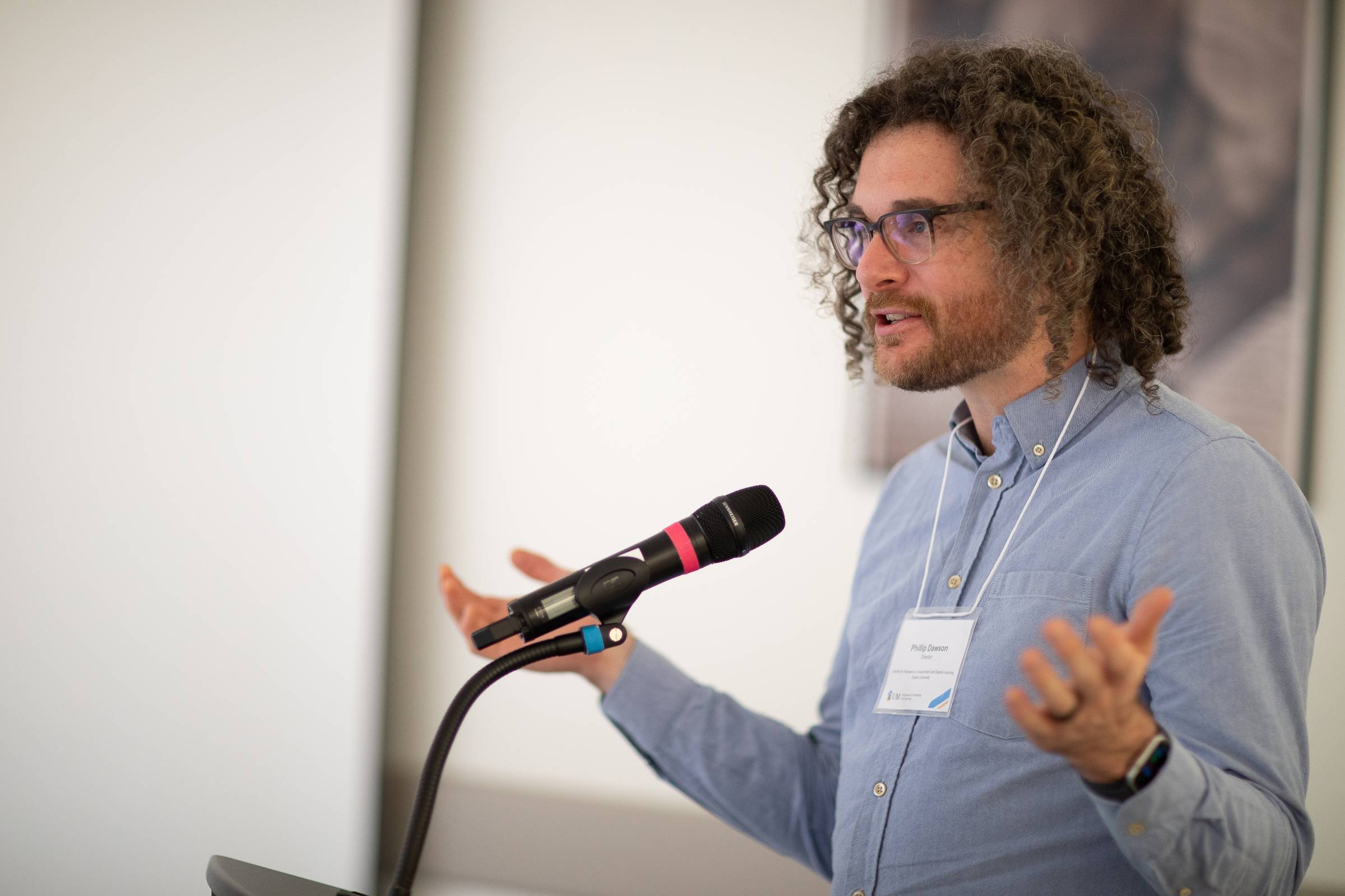 Man speaking at a podium at SoTL 2023