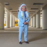 Jerry Daniels standing in the middle of a vacant building