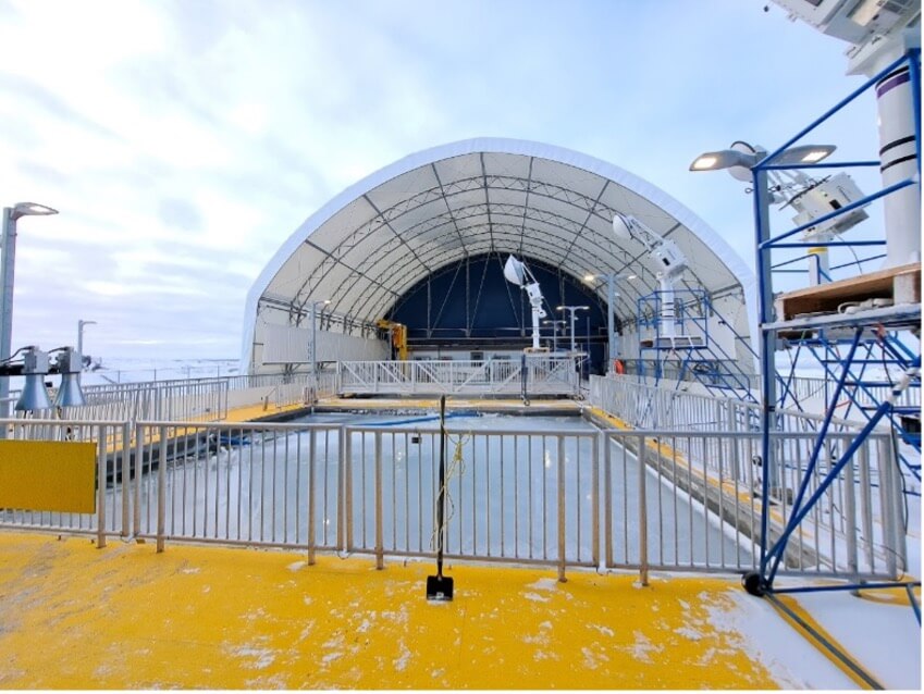 The Churchill Marine Observatory Ocean's Sea-Ice Mesocosm, the covered CMO building sits behind the pool outside waiting for sea-ice experiments.