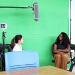 students and staff filming a video in the digital literacies lab