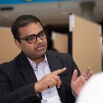 A student presenting their poster at MSHRF.