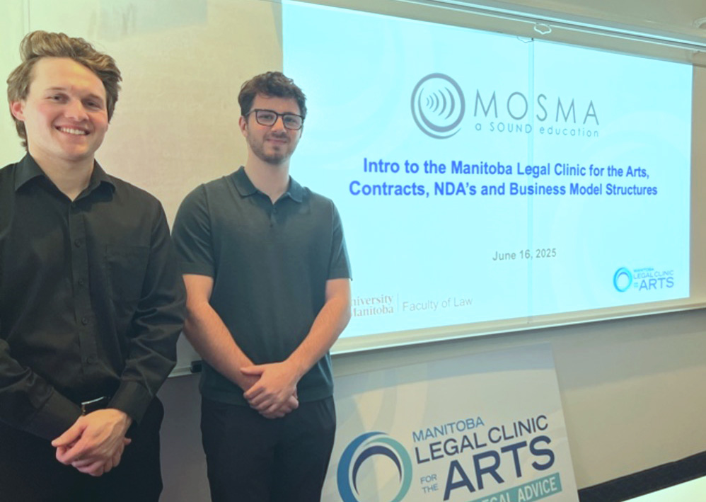 Left to right: Donald Plant (2L) and Lee Margolis (2L) stand in front of the Manitoba Legal Clinic for the arts poster and their power point presentation given to the Mid-Ocean School of Media Arts.