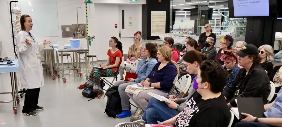 Dr. Sari Hannila (left) orienting folks at last year’s anatomy drawing session, May 2024 (source MAWA)