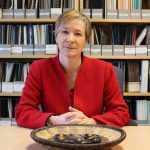 Dr. Josée Lavoie sitting at a table.