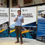 A person speaking with a microphone