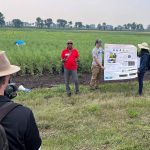 Dr Dilantha Fernando lectures in a field