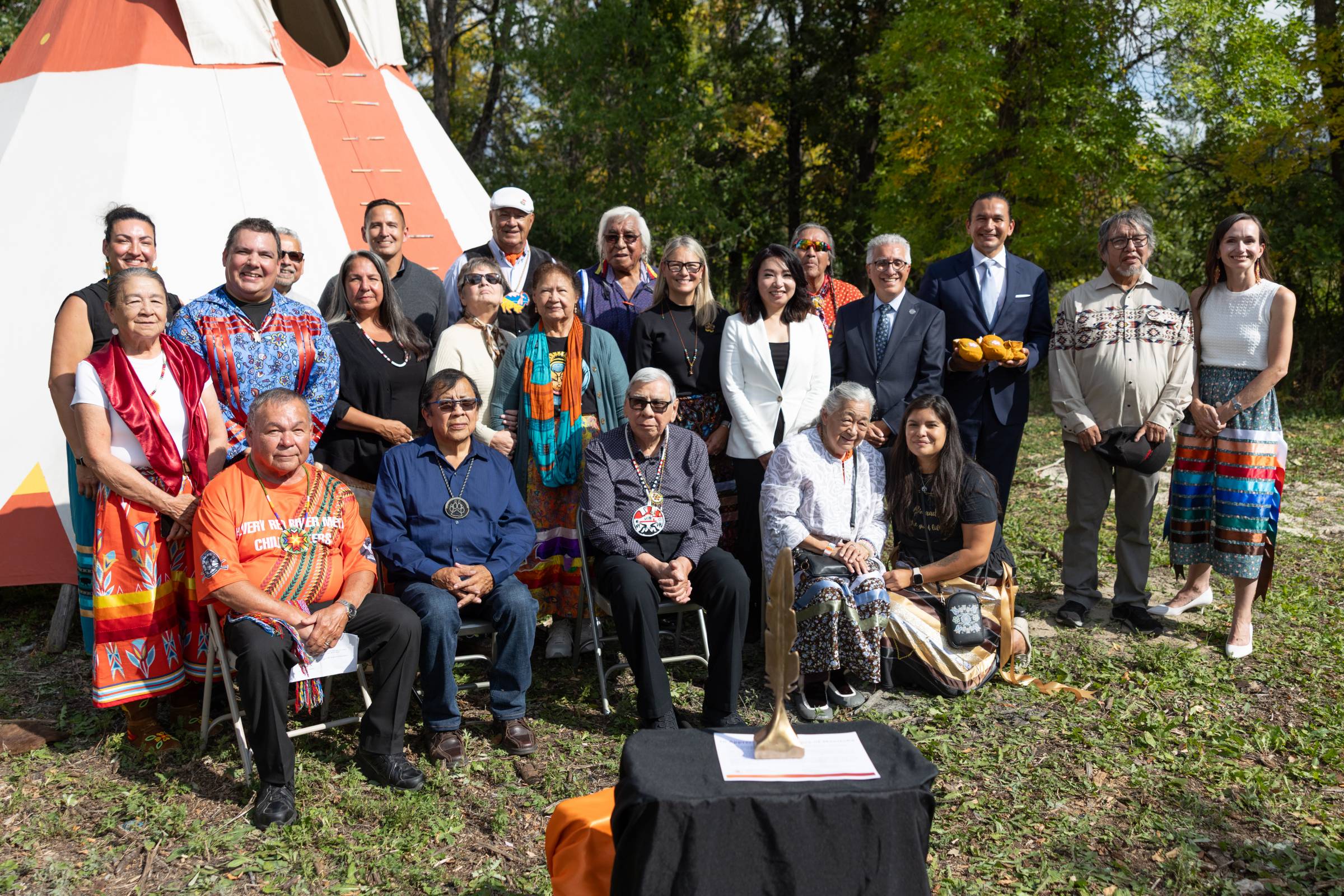 Elders, Survivors, and UM staff gathered with Premier Wab Kinew.
