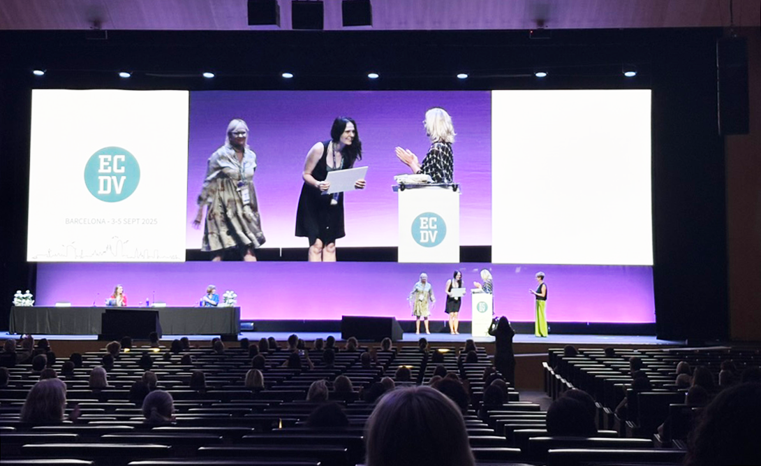 AmyAnne at the European Conference on Domestic Violence in Barcelona receiving the poster competition award