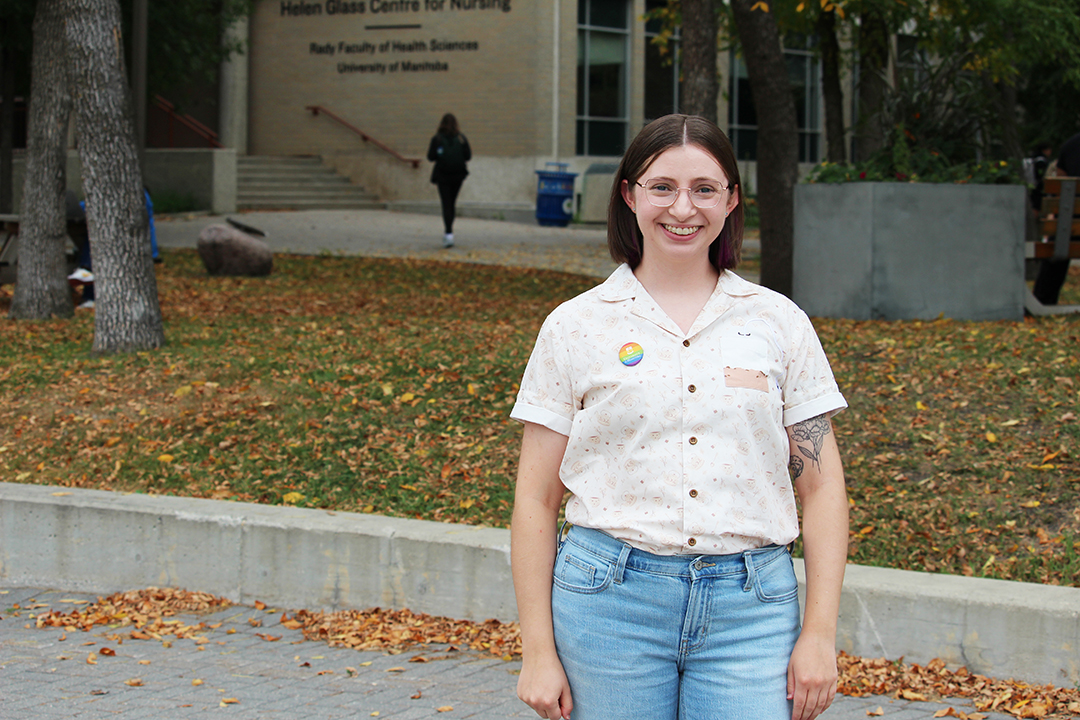 Ashley Bell stands outside of the College of Nursing's Helen Glass Centre for Nursing at Fort Garry campus.
