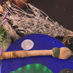 Bundle of ceremonial items including medicines, drum, and rattle