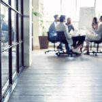 photo of group gathered at a meeting table