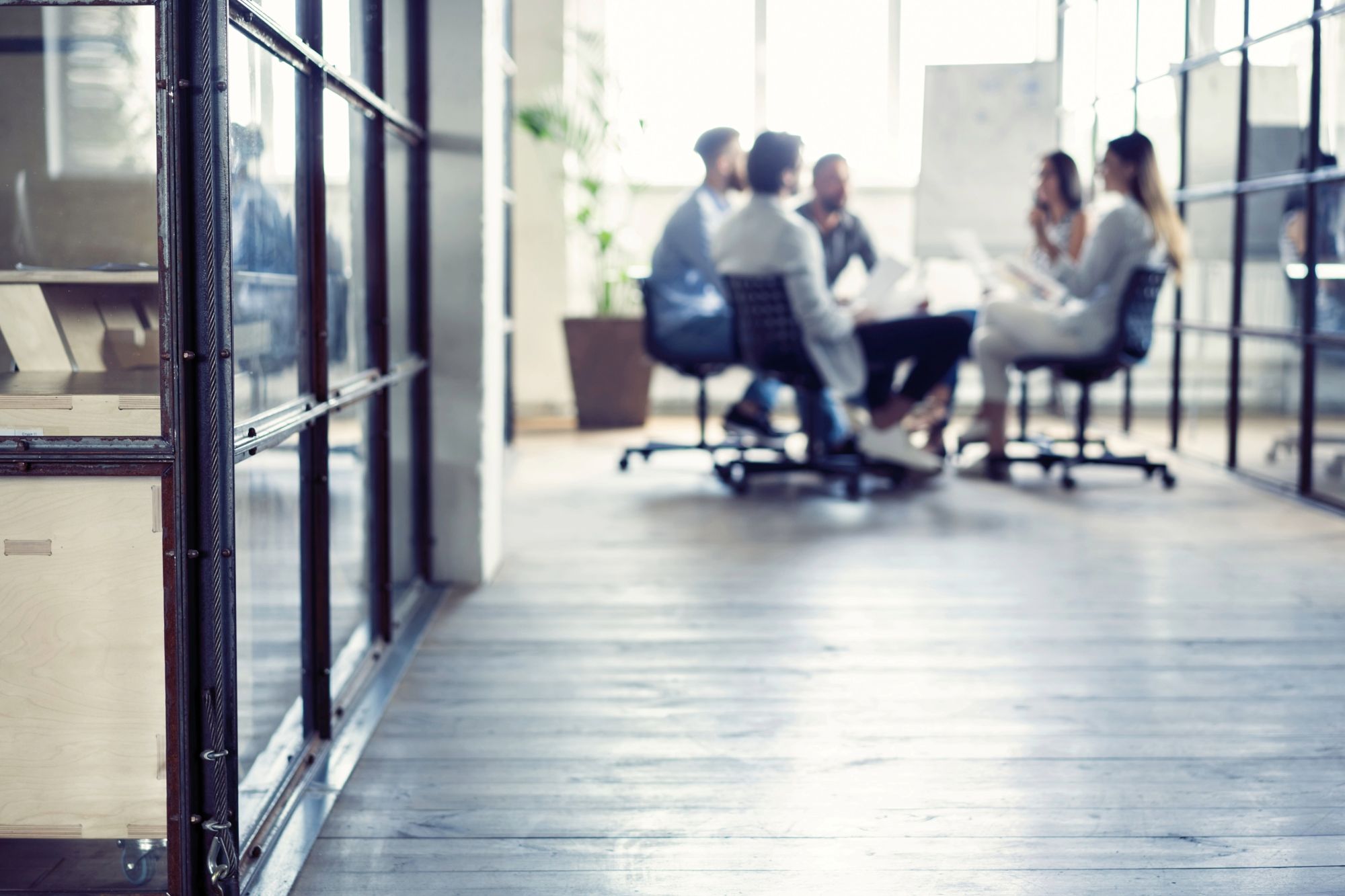 photo of group gathered at a meeting table