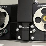 A machine with large wheels used for film digitization
